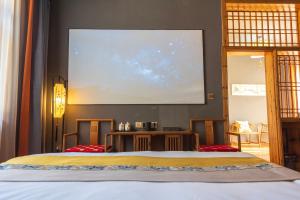 Park One B&B Zhangjiajie Forest Park Scenic Area Shop客房内的一张或多张床位