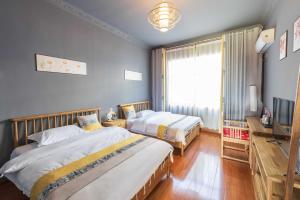 Park One B&B Zhangjiajie Forest Park Scenic Area Shop客房内的一张或多张床位
