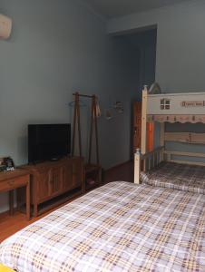 Park One B&B Zhangjiajie Forest Park Scenic Area Shop客房内的一张或多张床位