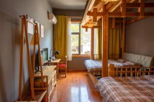 Park One B&B Zhangjiajie Forest Park Scenic Area Shop客房内的一张或多张床位