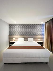 Postelja oz. postelje v sobi nastanitve SM Tower Hotel and Convention Berau