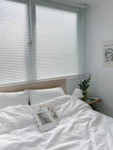 Postel nebo postele na pokoji v ubytování Nara Haus