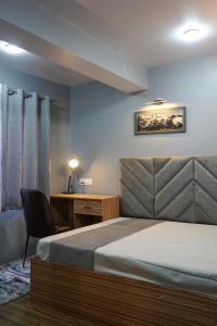 Postel nebo postele na pokoji v ubytování Moutain Souls A 3BHK Studio Apartment