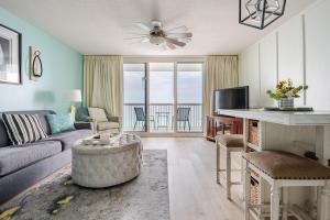 a living room with a couch and a table at Seaside Serenity - Destin, FL in Destin