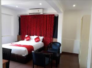 Ένα ή περισσότερα κρεβάτια σε δωμάτιο στο Coastal Residency Home Stay LLP