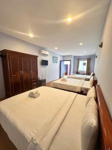 Postel nebo postele na pokoji v ubytování BUNGALOW HOTEL