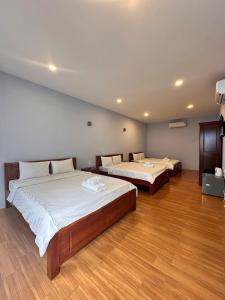 Postel nebo postele na pokoji v ubytování BUNGALOW HOTEL