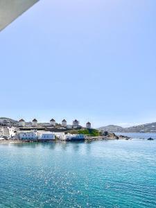 a view of a body of water with houses at Kyma Apartments-Little Venice,Mykonos in Mikonos