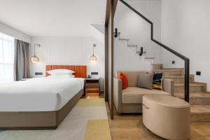 Voodi või voodid majutusasutuse Home2 Suite by Hilton Chongqing South Bank toas