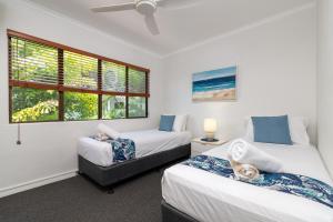 Ένα ή περισσότερα κρεβάτια σε δωμάτιο στο Tropical Reef Apartments +24 φωτογραφίες