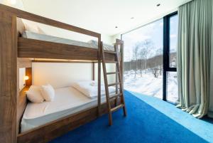 Postel nebo postele na pokoji v ubytování IORI Niseko 2