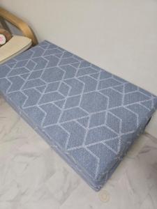 a blue rug sitting on top of a floor at K Story House LOVE HAPPY in Daegu +35 photos