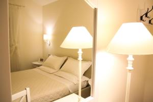 Postel nebo postele na pokoji v ubytování Anthos Casa Vacanze