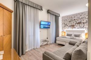 TV a/nebo společenská místnost v ubytování Roma dei Papi B&B