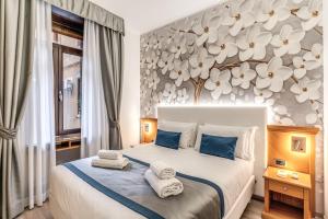 Postel nebo postele na pokoji v ubytování Roma dei Papi B&B + 37 fotografií