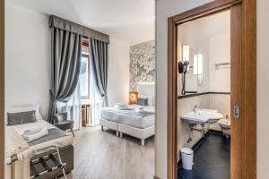 Postel nebo postele na pokoji v ubytování Roma dei Papi B&B