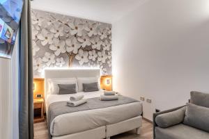 Postel nebo postele na pokoji v ubytování Roma dei Papi B&B