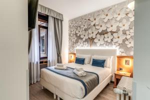Postel nebo postele na pokoji v ubytování Roma dei Papi B&B