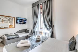 Postel nebo postele na pokoji v ubytování Roma dei Papi B&B