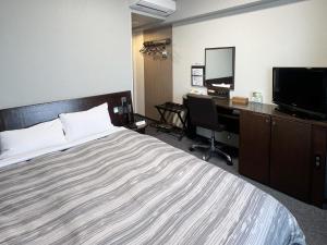 Postel nebo postele na pokoji v ubytování Hotel Route-Inn Shimodate