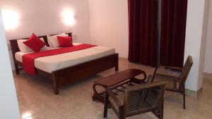 Postel nebo postele na pokoji v ubytování New Rani Inn