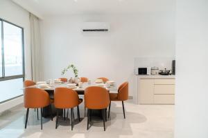 a dining room with a table and chairs at Georgetown Bright & Kid-Friendly KTV 3BR 15pax C in George Town