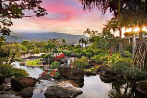 a rendering of a garden with a river and palm trees at Hanalei Bay Resort in Princeville