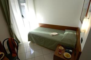 Posteľ alebo postele v izbe v ubytovaní Hotel Dorè