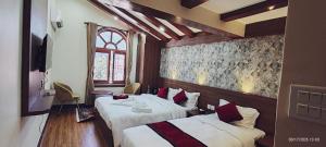 Postel nebo postele na pokoji v ubytování Lazimpat Boutique Hotel