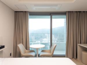 Postel nebo postele na pokoji v ubytování Hotel Wavellent Yangyang