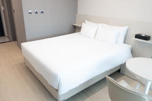 Postel nebo postele na pokoji v ubytování Hotel Wavellent Yangyang