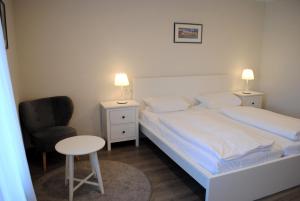 Postel nebo postele na pokoji v ubytování Hotel & Café Göller
