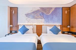 Katil atau katil-katil dalam bilik di Yunfei Hotel - Shanghai Hongqiao Wuzhong Road Branch