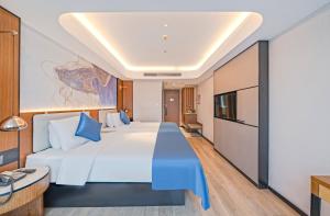 Katil atau katil-katil dalam bilik di Yunfei Hotel - Shanghai Hongqiao Wuzhong Road Branch