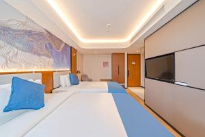 Katil atau katil-katil dalam bilik di Yunfei Hotel - Shanghai Hongqiao Wuzhong Road Branch