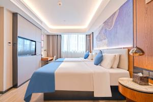 Katil atau katil-katil dalam bilik di Yunfei Hotel - Shanghai Hongqiao Wuzhong Road Branch