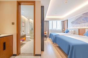 Katil atau katil-katil dalam bilik di Yunfei Hotel - Shanghai Hongqiao Wuzhong Road Branch