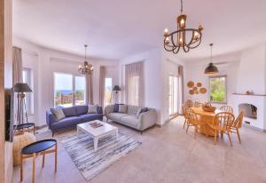 a living room with a couch and a table at Villa Melissa Kaş Peninsula in Kaş