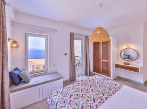 a bedroom with a bed and a window with a view at Villa Melissa Kaş Peninsula in Kaş +22 photos