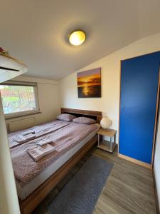 Ένα ή περισσότερα κρεβάτια σε δωμάτιο στο Apartma Vinko