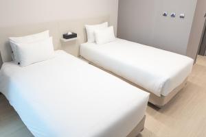 Postel nebo postele na pokoji v ubytování Hotel Wavellent Yangyang