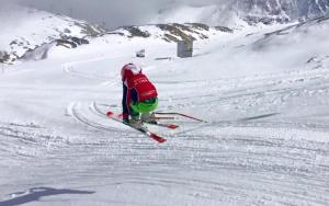 a person is skiing down a snow covered slope at Hotel Letterario Locanda Collomb in La Thuile