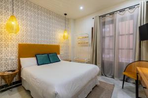 Giường trong phòng chung tại Argo7e Olehousing