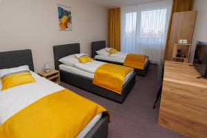 Rúm í herbergi á Hotel FIT