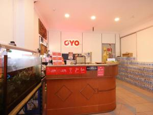 a restaurant with a msg sign on the counter at OYO 1090 Hollitel Hotel Melaka in Melaka