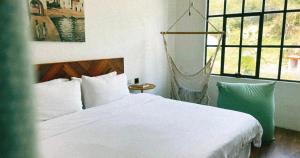 Una cama o camas en una habitación de il Piccolo Polpo Hotel