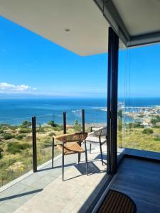 a view of the ocean from the balcony of a house at View At The Bay in Mossel Bay