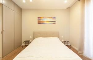 Un pat sau paturi într-o cameră la Stylish 1-Bedroom Apartment in Malta