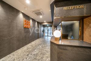 a lobby of a hotel with a reception desk at Browndot Hotel Hwamyeong in Busan