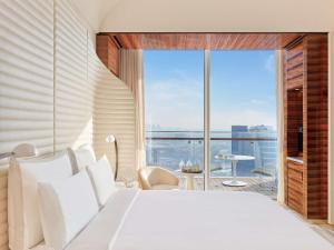 Vuode tai vuoteita majoituspaikassa Fairmont Doha